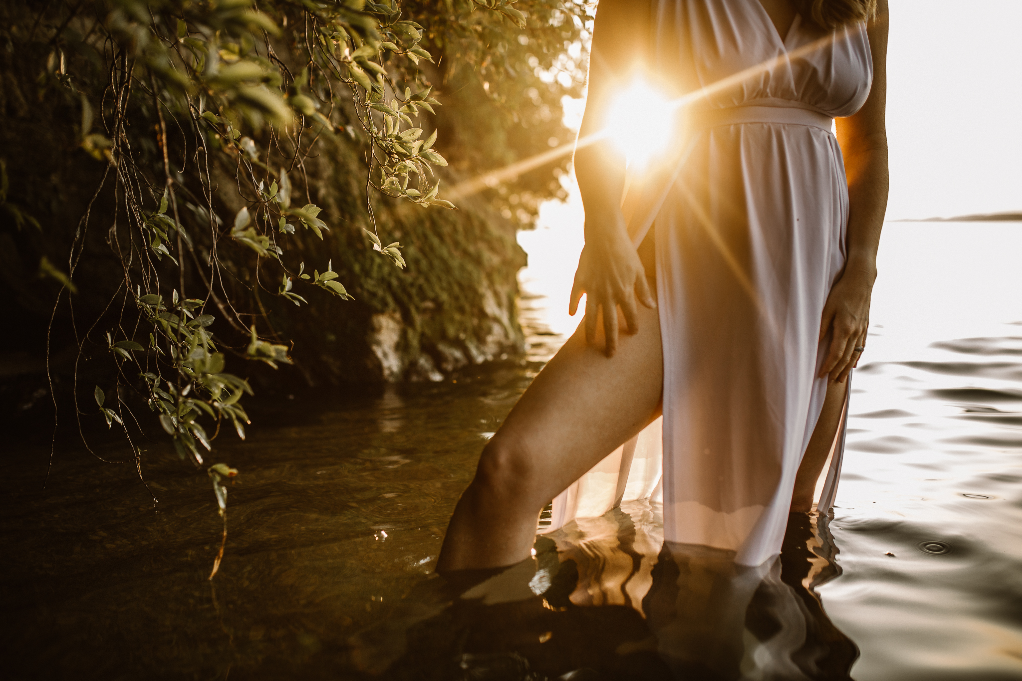 Captivating woman in an intimate lake session during a summer sunset.